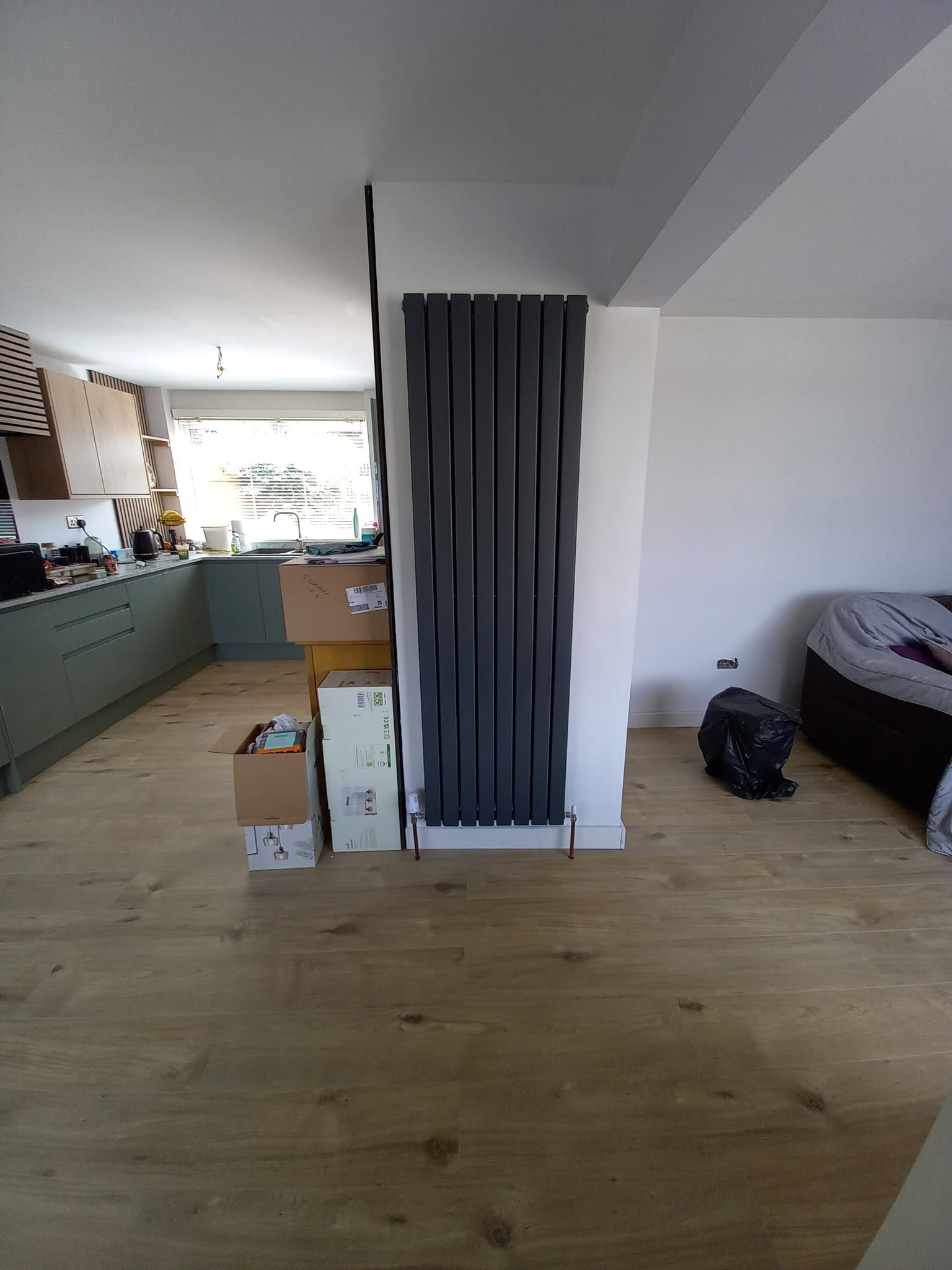 Radiator installation during an open-plan property refurbishment